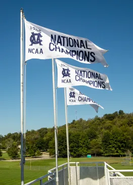 Marietta College Baseball National Champions flags fly above Pioneer Park