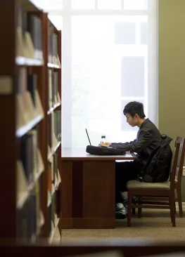 A Marietta College student majoring in history works on a project in the Legacy Library