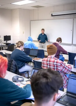 Professor Matt Williamson lectures to students majoring in Information Systems