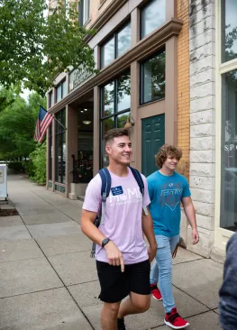 A Marietta College student walking down the sidewalk on Front Street