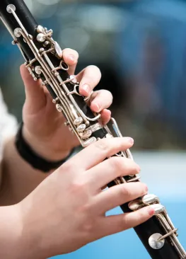 A Marietta College Music Therapy student holding a clarinet.