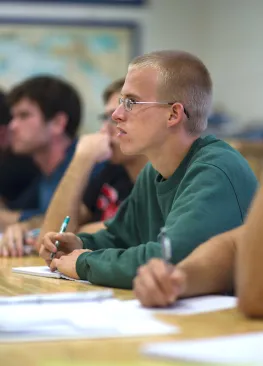 A Marietta College Petroleum Engineering major takes notes during class.