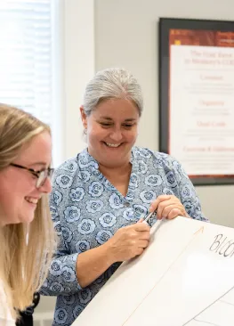 A Marietta College Education instructor works with a student