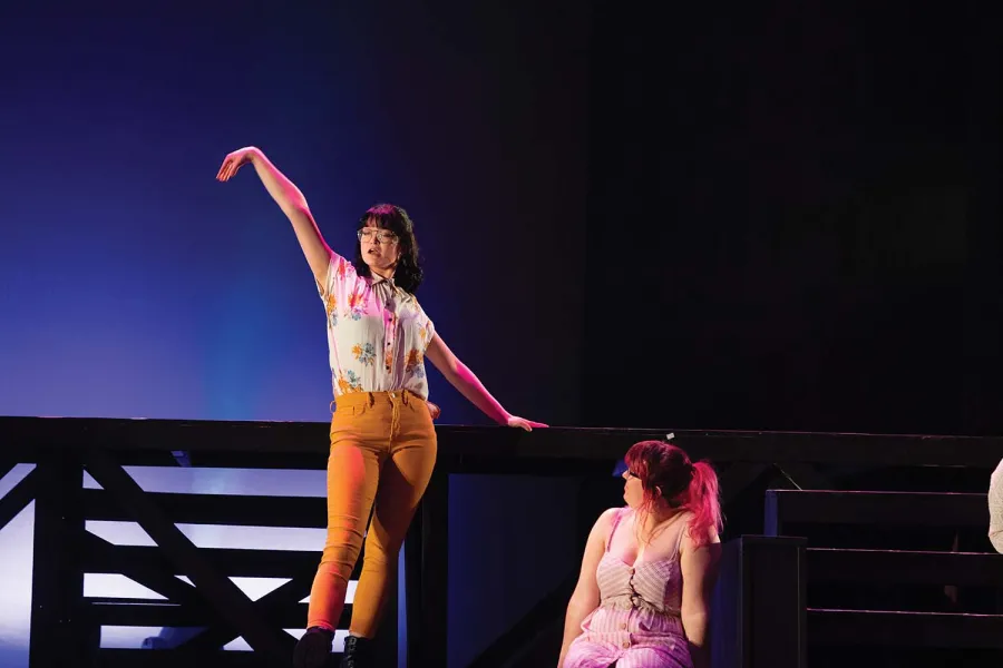  Featured soloist Joanie Owen ’23 (left) and Victoria Hughes ’21 perform “Turn Back, O Man” during the Theatre Department’s production of Godspell, which is set to stream on April 2nd and April 3rd.