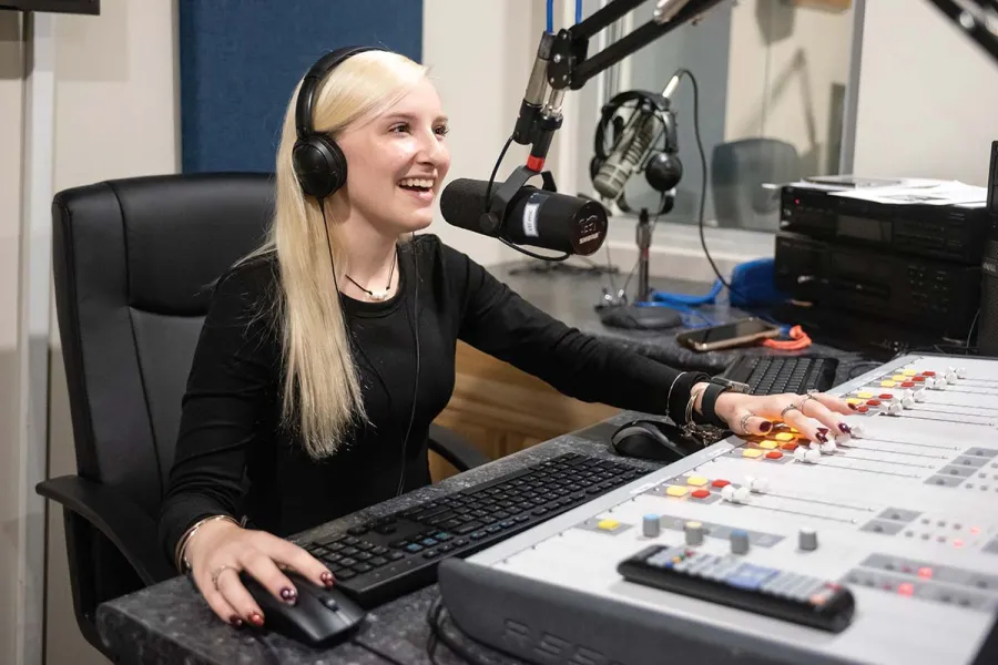 Hailey Lanham '25 in the Dream Weaver Recording Complex in McKinney Hall on the campus of Marietta College