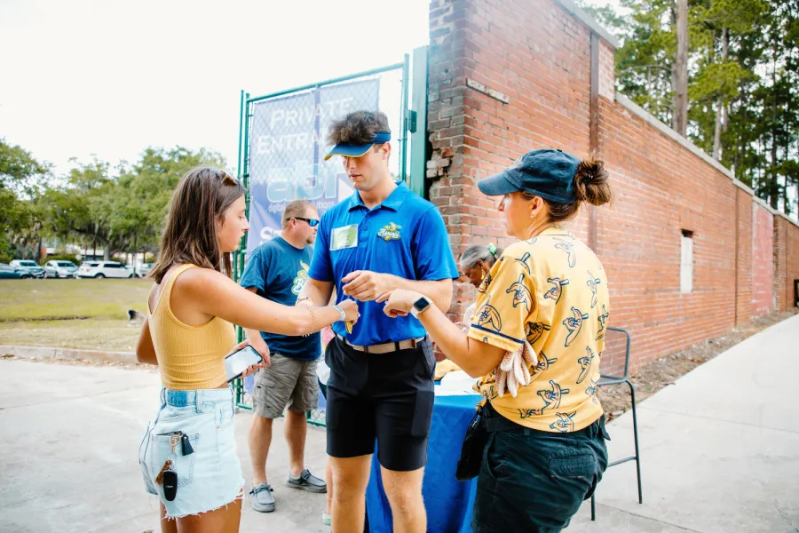 Marietta College Sport Management student check in fans at a Savanah Bananas game