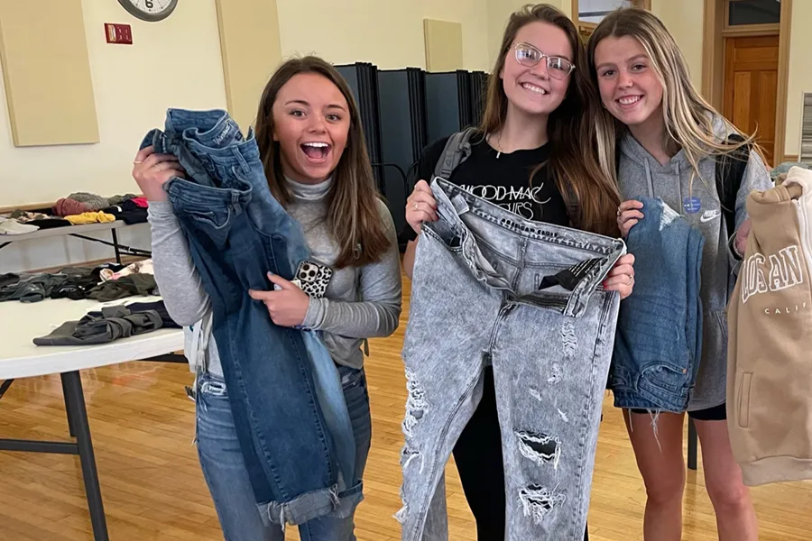 Three students shopping at Big Blue Thrift Store