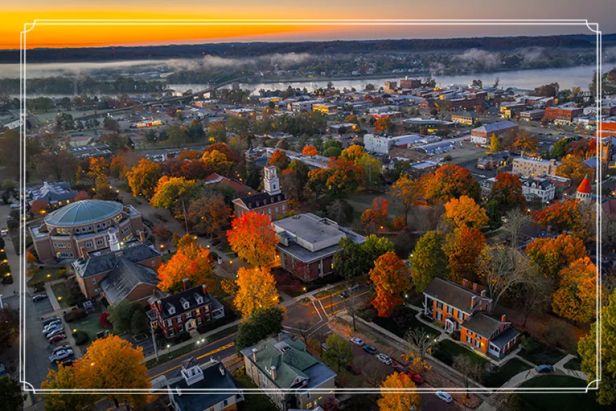 Aerial view of campus with Ohio River and sunrise